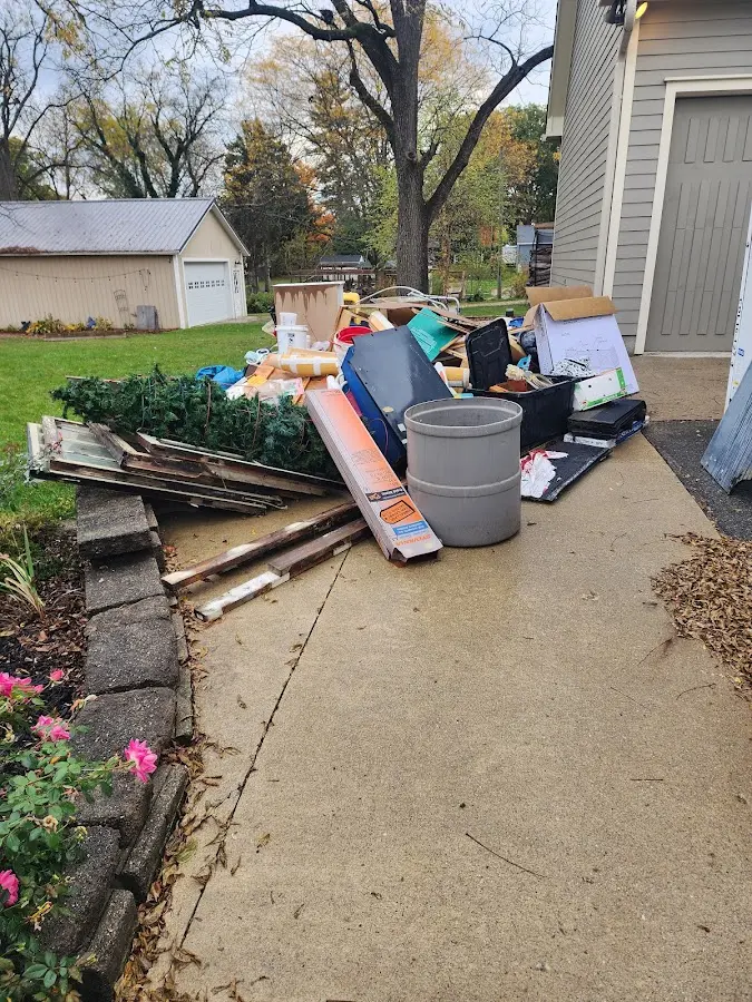 Dumpster being loaded with debris for Commercial Dumpster Rental in Fair Oaks